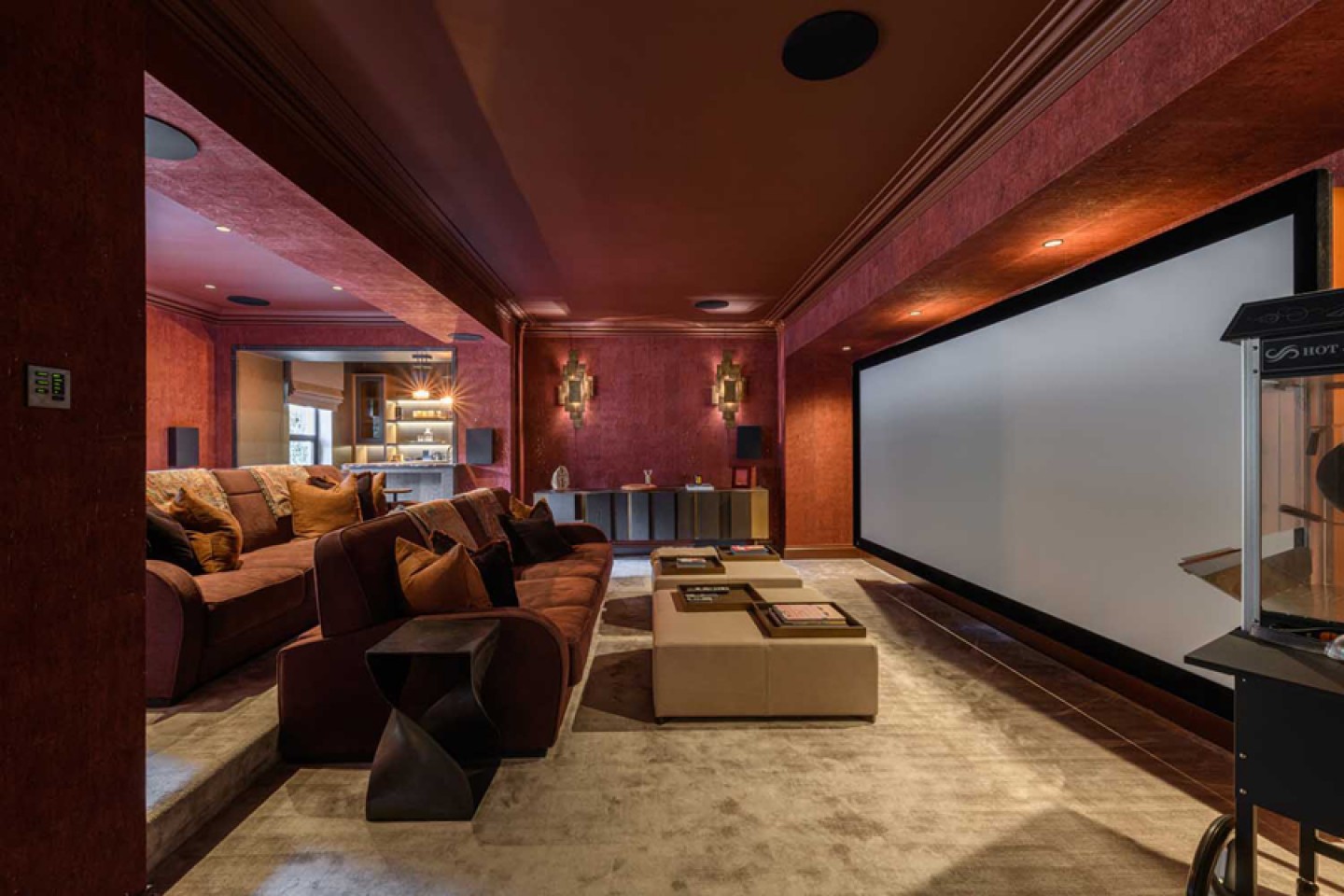 cinema room with a large projector screen and double row seating